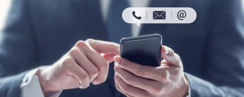 Contact-us-businessman-holding-mobile